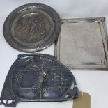 A 19th century silver plated charger embossed with a nude maiden and cherubs, indistinctly signed,