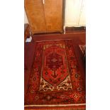 A North West Persian Zanjan rug, central diamond medallion with repeating petal motifs on a