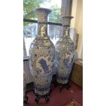 A large and impressive pair of early 20th century Chinese blue and white vases, decorated with