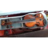 A vintage violin with case, together with a vintage wooden case and four bows