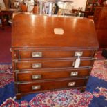 A Kennedy mahogany campaign bureau, brass inlaid, with drop flap above four graduating drawers,