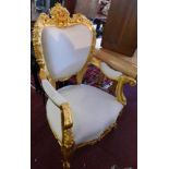 A pair of rococo style armchairs gilt painted in 24ct gold