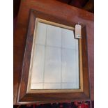 A Regency rosewood wall mirror, with original rectangular plate and gilt slip