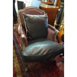 A French armchair with purple floral and faux crocodile skin upholstery, raised on cabriole legs