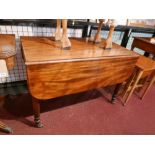 A 19th century mahogany pembroke table, with single end drawers raised on turned legs and castors