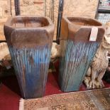 A set of four tall blue over black glazed planters, comprising two large, H.89 W.38 D.38cm, and