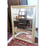 A contemporary gilt wall mirror, H.105cm W.75cm