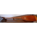 A wooden oar, by Gees of Twickenham, L.210cm