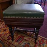 An Edwardian mahogany adjustable piano with green faux leather upholstery over turned stretchered