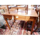 An Edwardian mahogany Campaign style writing table, with a single frieze drawer over square