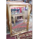 A contemporary giltwood wall mirror, H.105cm W.75cm
