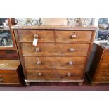 A 19th Century flame mahogany chest of two short over three long graduated drawers raised on