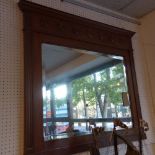 An early 20th century oak over mantle mirror with bevelled plate and reeded border, 97x109cm