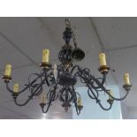 A contemporary wrought metal eight branched chandelier, H80cm