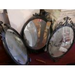 A set of three wrought iron mirrors, 90x52cm