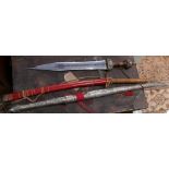 A 20th century Japanese sword in bamboo sleeve together with two decorative swords