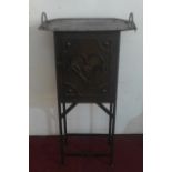 An early 20th Century Arts and Crafts riveted copper cabinet on stand, with heart motif