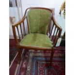 An Edwardian Sheraton Revival mahogany and boxwood inlaid chair, with green upholstery decorated