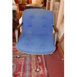 A contemporary swivel desk chair, with blue button back upholstery