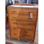 A mid 20th Century French light oak chest of five drawers raised on cabriole supports, H.110cm W.