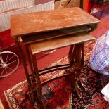 An early 20th century lacquered oriental nest of three tables