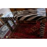 A contemporary faux zebra skin upholstered console table, H.81 W.140 D.41cm