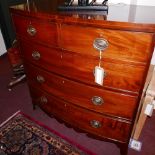 A Georgian mahogany bow front chest of two short over three long drawers, with boxwood inlay, raised
