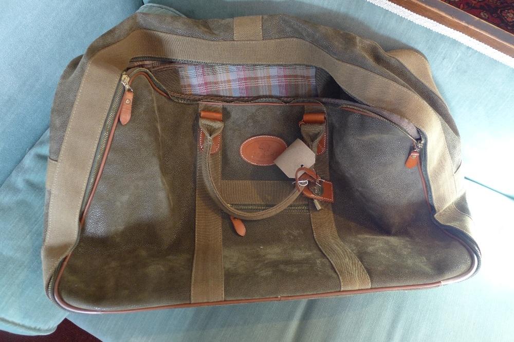 A Mulberry green suede duffel bag