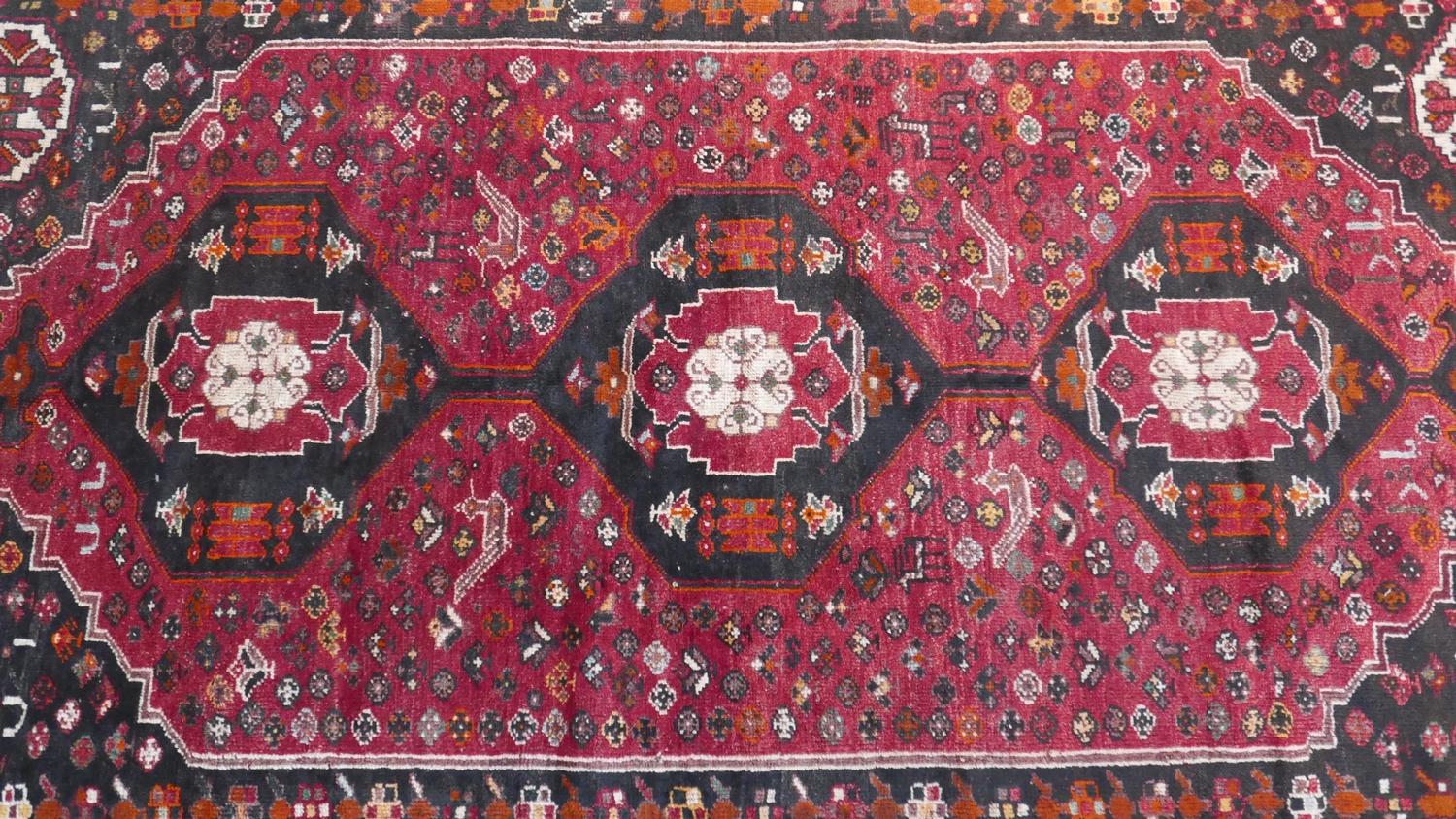 A South West Persian Qashgai carpet, 274cm X 170cm. Triple pole medallion with repeating animal - Image 2 of 3