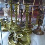 Ten brass and silver plated candlesticks and four snuffers