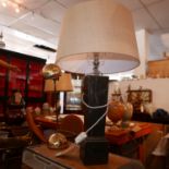 A faux marble painted table lamp with a linen drum shade, H.74cm, together with a mid century gilt