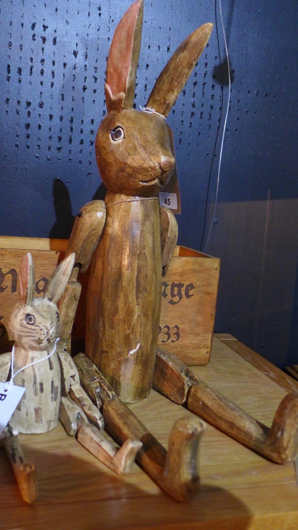 A vintage style boxed pair of wooden bunnies