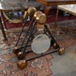 A set of three French wall hanging brass coat hooks on triangular metal frames, one with circular