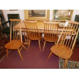 A set of four mid century Ercol dining chairs with spindle backs, H.99cm (4)