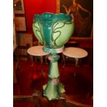 WITHDRAWN - An early 20th Century Art Nouveau green glazed ceramic jardinere on stand, H.88cm