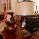 A 20th Century leather and brass table lamp with shade, together with an Oriental lacquered double