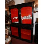 A late 19th Century ebonised display case, with twin arched glazed doors, with fitted red baize