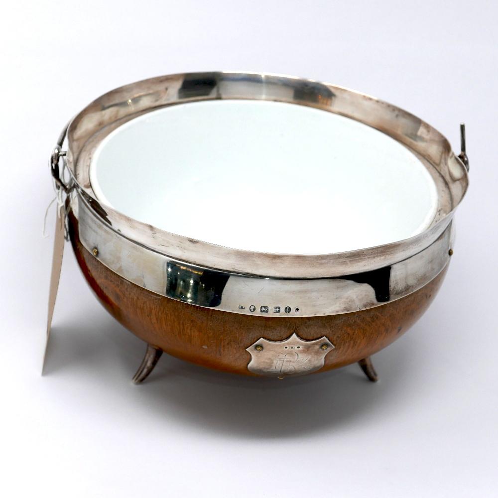 A Victorian silver and oak jardiniere by Henry Bourne, dated 1880, raised on silver peg feet with