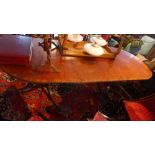 A Regency style mahogany D-end dining table, with extra leaf