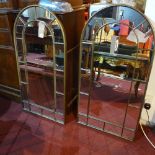 A pair of arched garden mirrors with metal frames in a bronzed finish, H.110cm (2)