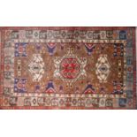 A North West Persian Nahawand rug, 192cm X 123cm. Triple pole medallion with repeating geometrical
