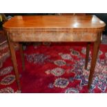 A 19th century mahogany and boxwood inlaid fold over tea table, raised on tapered legs, H.74 W.92