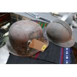 A set of two steel German and French military helmets (2)