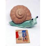 A large, Sylvac Ware pottery snail with green glazed body and pale brown shell, 22 x 25cm, with a