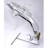 A Daum France crystal dolphin on chrome stand, signed, H.45cm