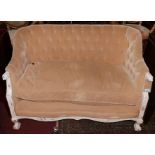 An early 20th century French settee, with deep buttoned brown velour upholstery raised on white