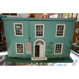 A 1950's Tri-ang dolls house, H.40 W.64 D.33cm