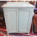 A turquoise distressed painted side cabinet, with two cupboard doors, raised on square feet, H.98