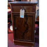 An early 20th century French flame mahogany side cabinet, with a grey marble top over cupboard door,