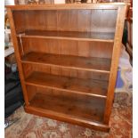 An early 20th century large oak open bookcase, with adjustable shelves raised on stepped base, H.128